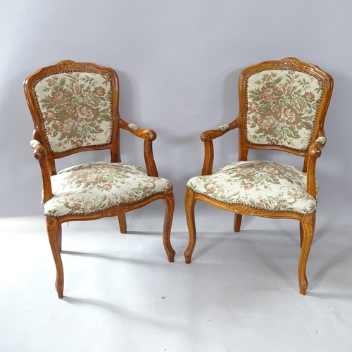 2264 - A pair of Continental walnut and upholstered open arm parlour chairs