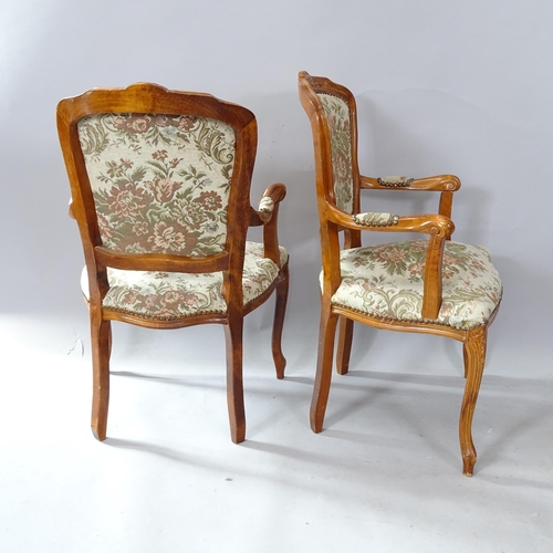 2264 - A pair of Continental walnut and upholstered open arm parlour chairs