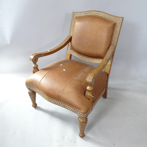 2267 - A Continental style walnut and faux leather-upholstered open armchair