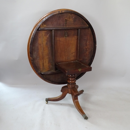 2278 - A 19th century mahogany tilt-top dining table, 115cm x 68cm