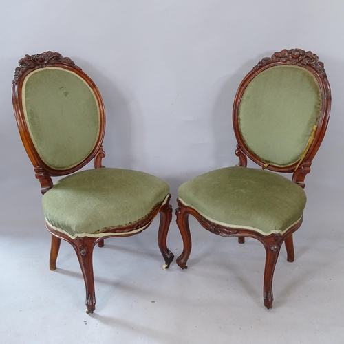 2280 - A pair of Continental style walnut parlour chairs, with carved decoration