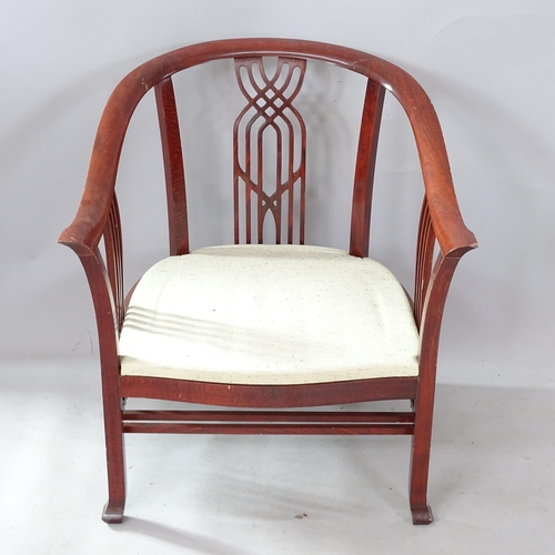 2292 - A Giorgetti tub armchair, with fretwork back and sides, with maker's marks