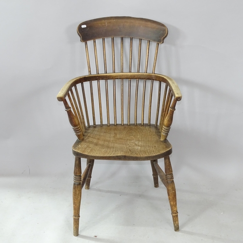 2295 - An Antique elm-seated kitchen bow arm chair