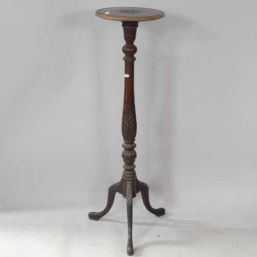 2299 - A carved oak torchere stand on tripod base, 108cm