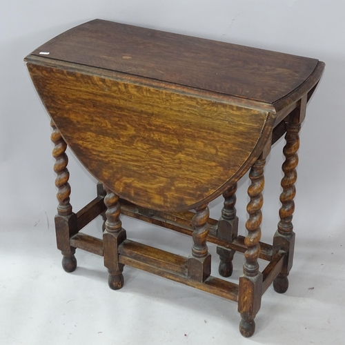 2302 - An Antique oak oval gateleg table, with barley twist columns, 77cm x 72cm x 36cm