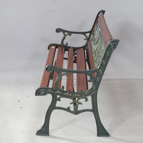 2303 - A child's wrought-iron garden bench, with carved and pierced animal decoration, 83cm x 50cm x 38cm