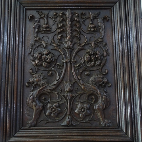 2309 - An Antique fine relief carved oak Classical panel, probably 18th century, with raised griffon and sc... 