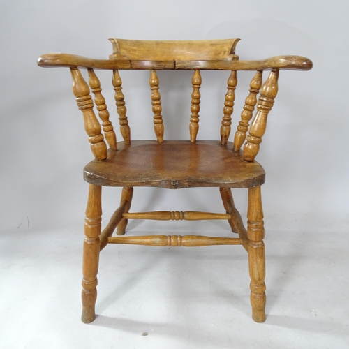 2313 - An oak and elm-seated smoker's bow-arm chair