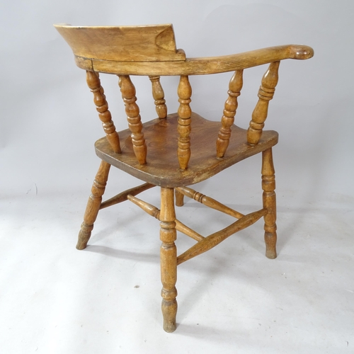 2313 - An oak and elm-seated smoker's bow-arm chair