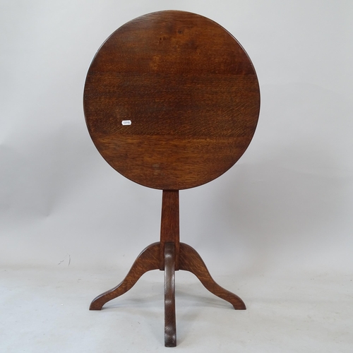 2320 - An oak circular tilt-top occasional table, 49cm x 54cm