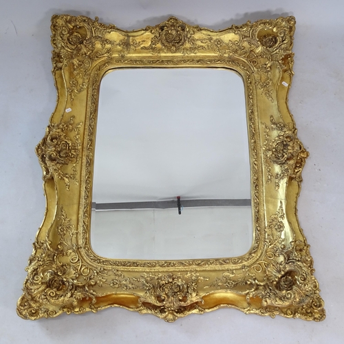 2327 - A modern bevel-edge wall mirror, in gilt-gesso frame