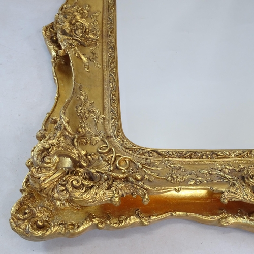 2327 - A modern bevel-edge wall mirror, in gilt-gesso frame