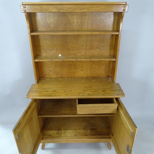 2340 - A mid-century brutalist oak dresser by F Co, the plate rack over 2 door cupboard with interior drawe... 