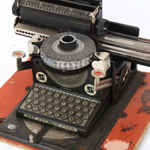 483 - An early 20th century German tinplate toy Junior typewriter, circa 1920, by Gebruder Schmidt Nurembe... 