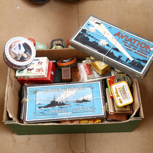 496 - A large selection of Vintage board games, and Vintage advertising tins, including Player's Navy Cut ... 