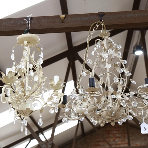 499 - A pair of modern painted metal 5-branch chandeliers, and a similar smaller chandelier