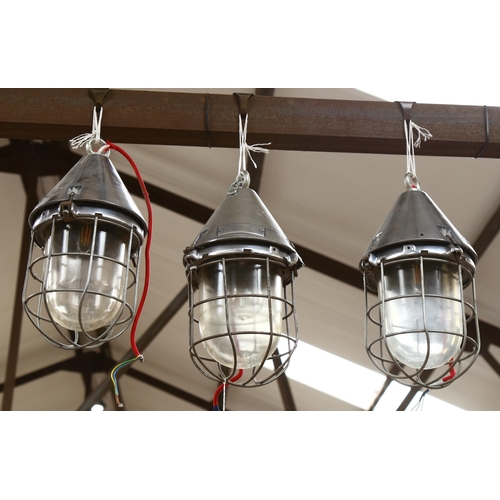 501 - A set of 3 polished metal bulkhead lantern, Honex glass bowls, length 40cm