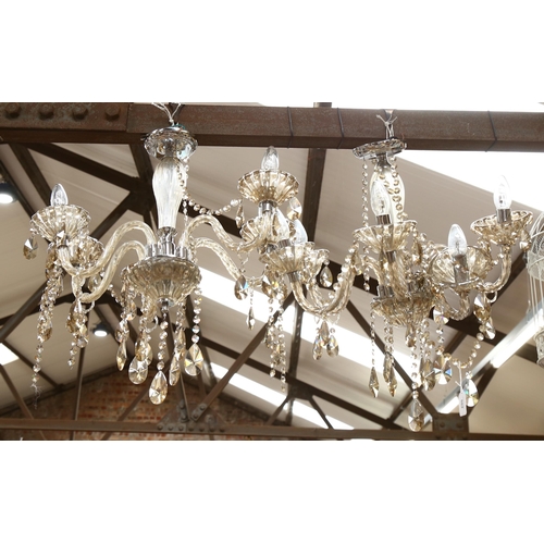 502 - A pair of modern glass and chrome 5-branch chandeliers (A/F), height 60cm approx