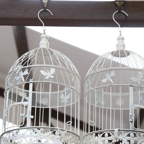 503 - A pair of modern painted wirework metal bird cages, height 50cm