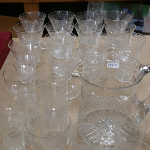 507 - A suite of Vintage etched glassware, including 13 Champagne glasses, tumblers etc, and water jug (29... 