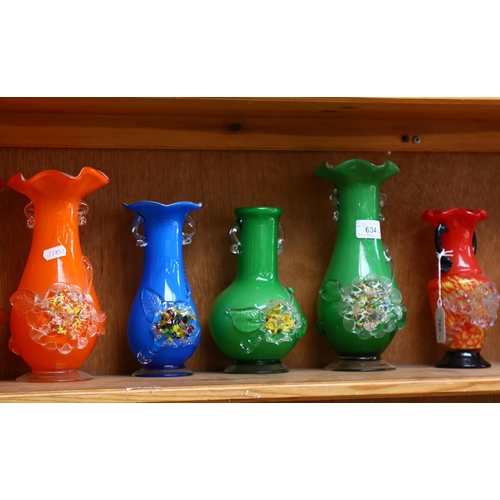 763 - A shelf of colourful 1950s glass vases with applied floral decoration, tallest 25cm