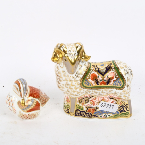 785 - A Royal Crown Derby humming bird with a gold stopper, and a Royal Crown Derby ram with a gold stoppe... 