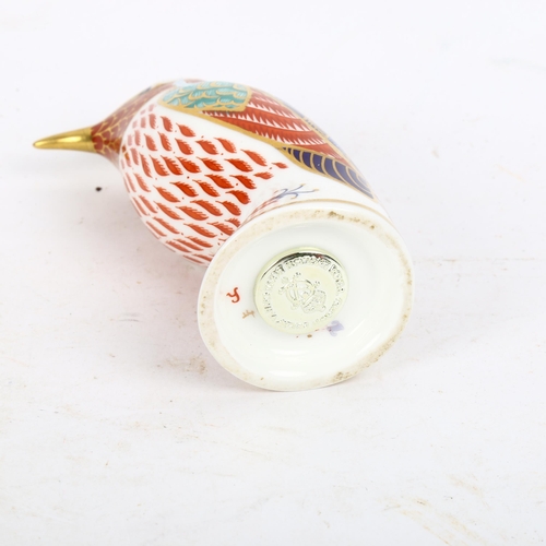 790 - A Royal Crown Derby hummingbird with a silver stopper, height 10cm