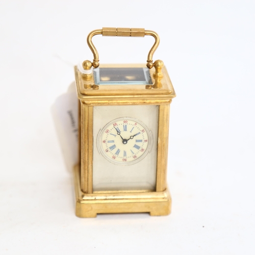 802 - A reproduction miniature brass-cased carriage clock, height 6cm