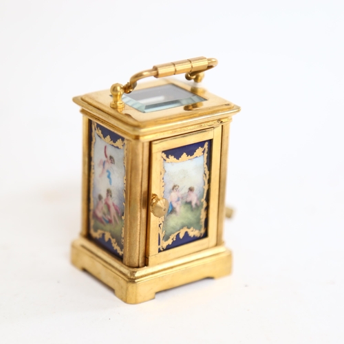 802 - A reproduction miniature brass-cased carriage clock, height 6cm