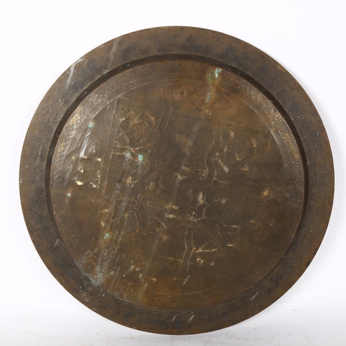 807 - A Turkish brass charger, with silvered and brass embossed decoration, width 35cm