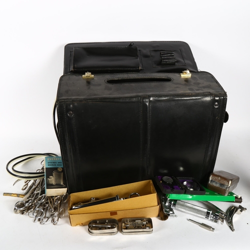 559 - A physician's case and contents, including medical instruments and tools