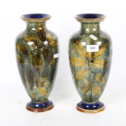 585 - A pair of Royal Doulton Autumn Leaves baluster vases, height 31cm, 1 A/F