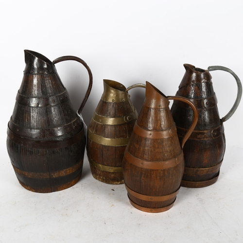 590 - 4 coopered oak Continental jugs with copper and brass bands, tallest 30cm