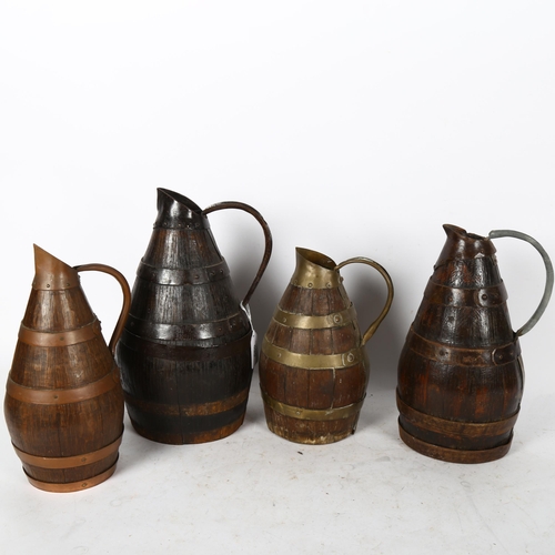 590 - 4 coopered oak Continental jugs with copper and brass bands, tallest 30cm