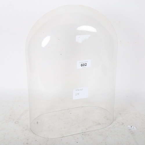 602 - A glass dome, internal measurements: W26cm, H34cm, D14cm