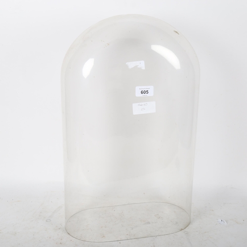 605 - A glass dome, internal measurements: W31cm, H49cm, D16.5cm