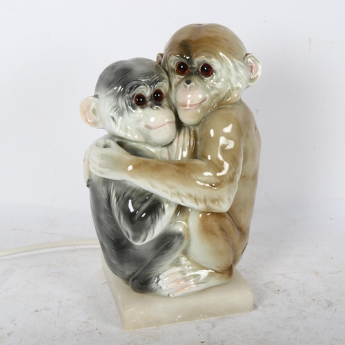 606 - A Naples table lamp, modelled as 2 monkeys, on alabaster stand, height 26cm