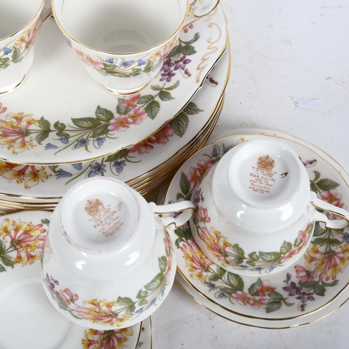 612 - A Paragon Country Lane part-service, comprising of 6 dinner plates, a cake plate, 6 cups saucers and... 