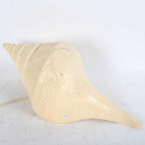 628 - A large seashell converted to a lamp, with carved bird decoration, length 50cm