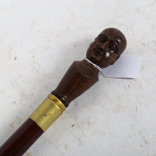 630 - A turned wood walking stick, with phrenology head knop, length 90cm