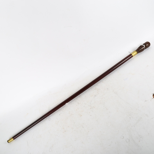 630 - A turned wood walking stick, with phrenology head knop, length 90cm