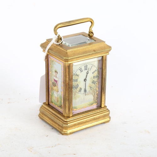 641 - A miniature reproduction brass carriage clock, height 7.5cm not including handle