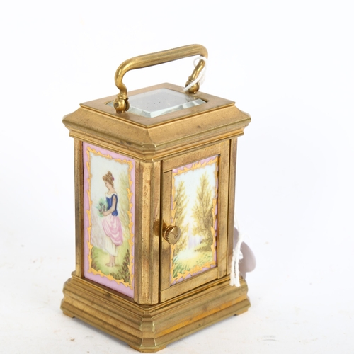 641 - A miniature reproduction brass carriage clock, height 7.5cm not including handle