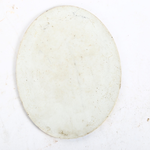 642 - A Continental painted ceramic oval plaques, depicting a young girl holding a book, length 16.5cm