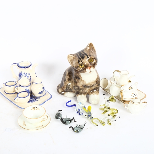 648 - 2 doll's house part tea sets, a collection of miniature glass animals, and a small Winstanley cat wi... 