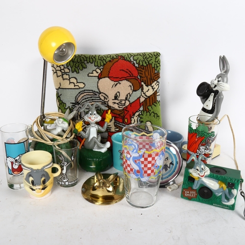 654 - A collection of Bugs Bunny memorabilia, including clock, stick telephone, mugs etc