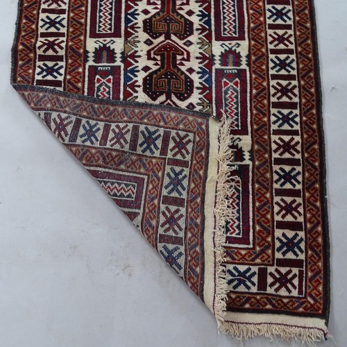 2379 - A red and cream ground Afghan prayer rug, 150cm x 83cm