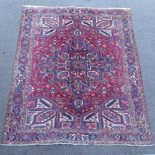 2381 - A red and blue ground Caucasian carpet, 385cm x 282cm