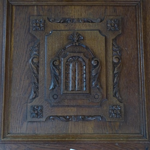 2396 - A pair of oak panelled doors with carved armorial decoration, each 65cm x 63cm