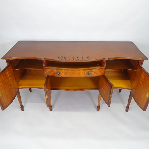 2502 - A reproduction mahogany and satinwood-strung bow-front sideboard, on square tapered legs and square ... 